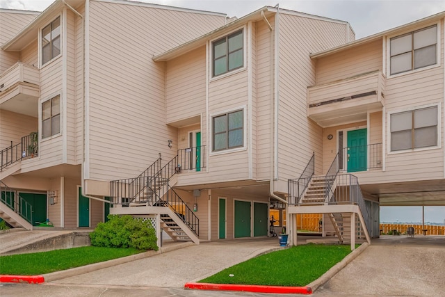 view of property featuring stairway