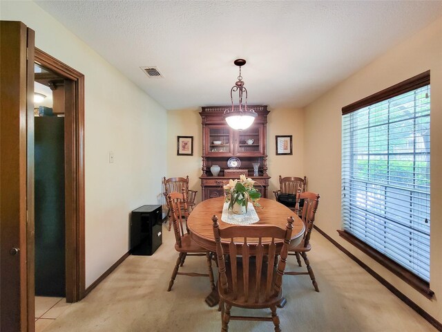 14926 Carols Way Dr, Houston, TX 77070 - dining room featuring baseboards, visible vents, and light colored carpet