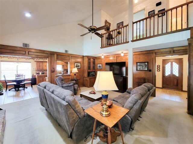 14926 Carols Way Dr, Houston, TX 77070 - living area featuring light tile patterned floors, visible vents, plenty of natural light, a ceiling fan, and high vaulted ceiling