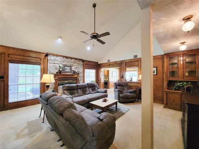 14926 Carols Way Dr, Houston, TX 77070 - living area with light colored carpet, visible vents, a fireplace, a ceiling fan, and high vaulted ceiling