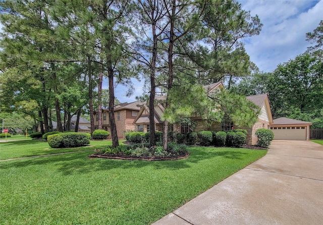 14926 Carols Way Dr, Houston, TX 77070 - view of front of property featuring brick siding, a front yard, and concrete driveway