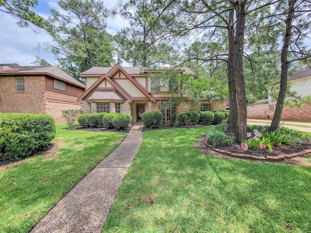 14926 Carols Way Dr, Houston, TX 77070 - tudor home featuring brick siding and a front lawn