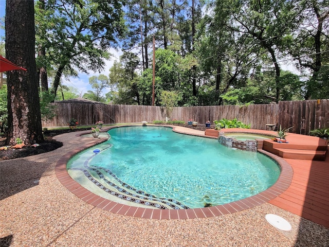 14926 Carols Way Dr, Houston, TX 77070 - view of pool with a pool with connected hot tub and a fenced backyard