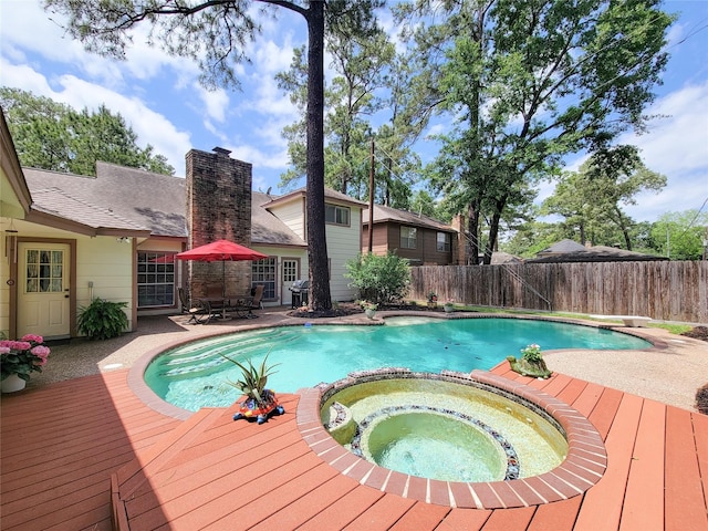 14926 Carols Way Dr, Houston, TX 77070 - view of pool with a diving board, a deck, a fenced backyard, and a pool with connected hot tub