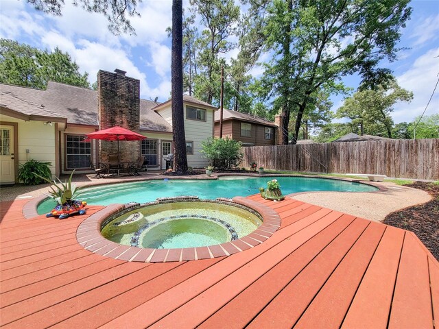 14926 Carols Way Dr, Houston, TX 77070 - view of swimming pool featuring a fenced backyard, an in ground hot tub, a wooden deck, and a fenced in pool