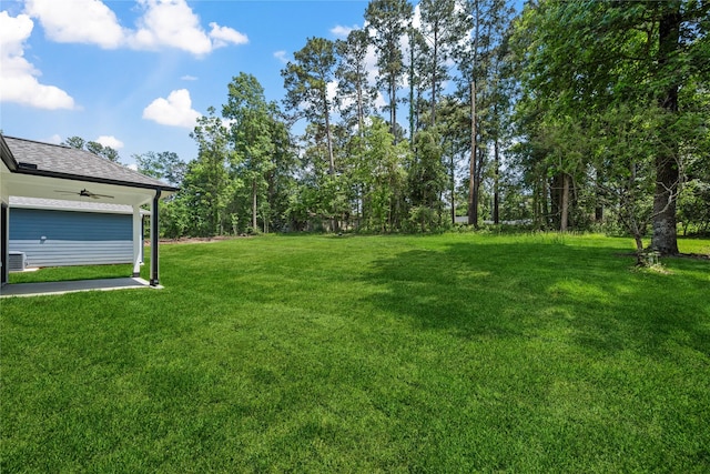 view of yard featuring ceiling fan
