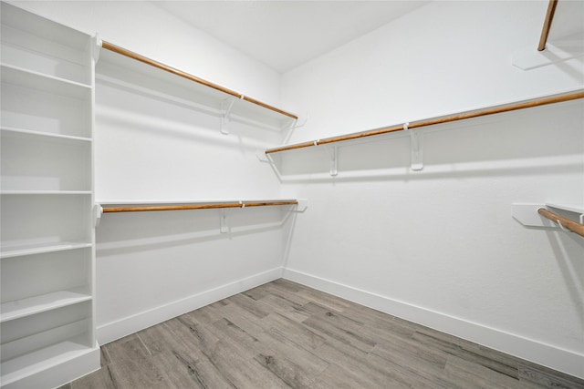 spacious closet with wood finished floors