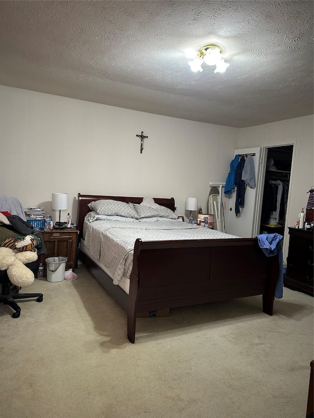 carpeted bedroom with a textured ceiling