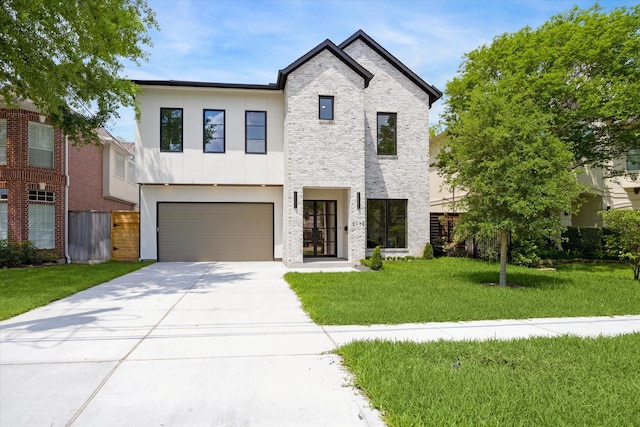 modern home featuring stucco siding, fence, a garage, a front lawn, and concrete driveway
