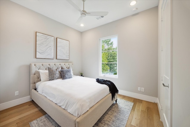 bedroom with visible vents, light wood-style floors, recessed lighting, and baseboards