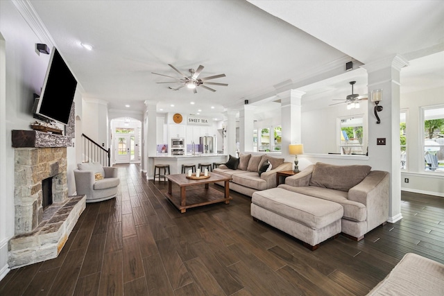 1603 Evening Bend Ct, Sugar Land, TX 77479 - living room featuring decorative columns, ceiling fan, ornamental molding, dark wood-type flooring, and recessed lighting