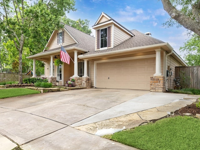 1603 Evening Bend Ct, Sugar Land, TX 77479 - craftsman house featuring covered porch, roof with shingles, driveway, stone siding, and an attached garage
