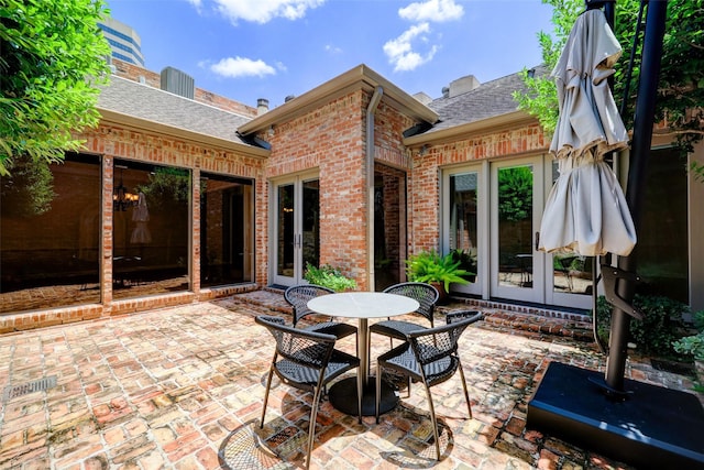 4856 Post Oak Timber Dr, Houston, TX 77056 - view of patio / terrace with french doors and outdoor dining area