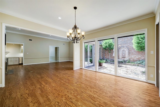 4856 Post Oak Timber Dr, Houston, TX 77056 - unfurnished room with crown molding, an inviting chandelier, wood finished floors, and baseboards
