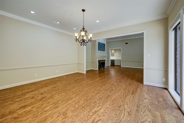 4856 Post Oak Timber Dr, Houston, TX 77056 - spare room featuring an inviting chandelier, wood finished floors, crown molding, and recessed lighting
