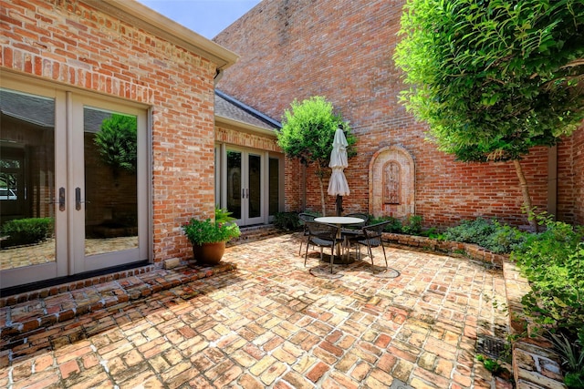4856 Post Oak Timber Dr, Houston, TX 77056 - view of patio featuring outdoor dining space and french doors