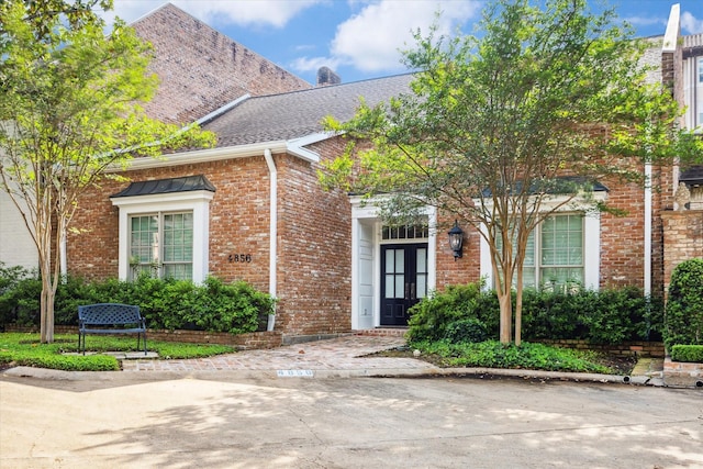 4856 Post Oak Timber Dr, Houston, TX 77056 - view of front of home with roof with shingles, french doors, and brick siding