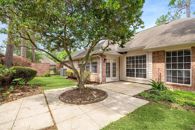 16610 Shadow Path Dr, Houston, TX 77059 - view of patio / terrace with french doors and central AC