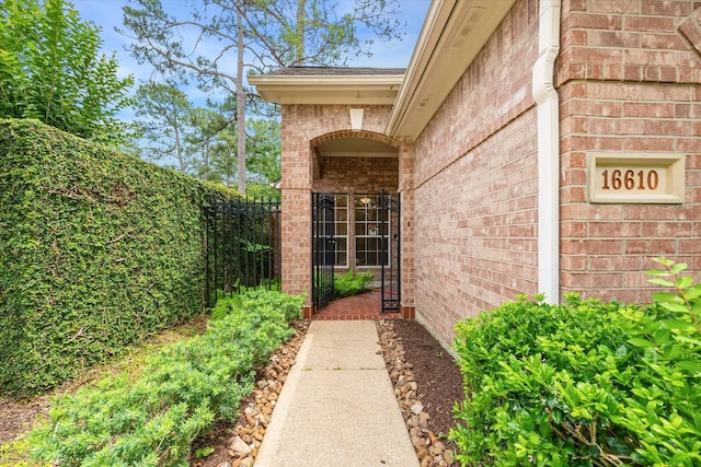 16610 Shadow Path Dr, Houston, TX 77059 - property entrance featuring brick siding and fence