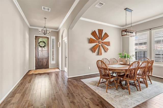 dining room featuring baseboards, dark wood-style flooring, a chandelier, and visible vents