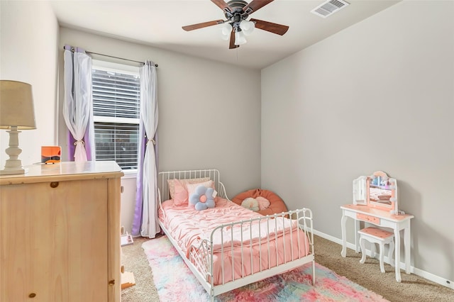 bedroom featuring baseboards, a ceiling fan, visible vents, and carpet floors