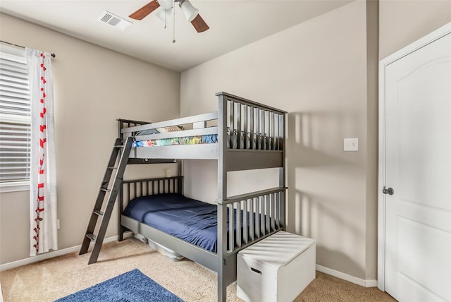 bedroom featuring baseboards, visible vents, and carpet