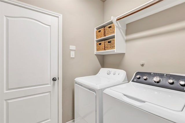 clothes washing area with washer and dryer and laundry area