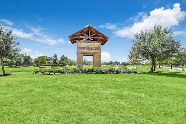 view of property's community with a yard