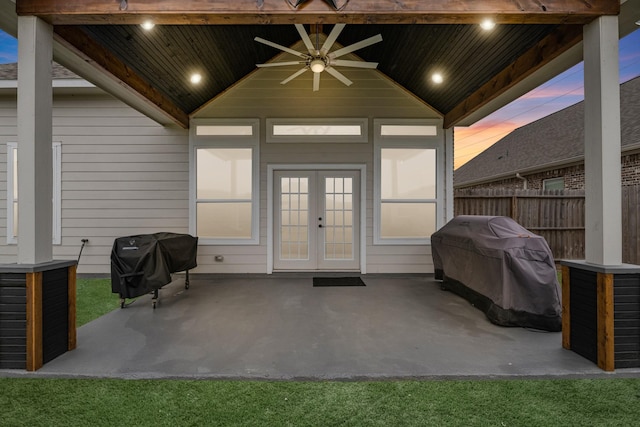property entrance featuring fence, a ceiling fan, a patio area, and french doors