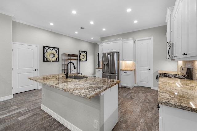 kitchen featuring a sink, stainless steel appliances, tasteful backsplash, ornamental molding, and white cabinets
