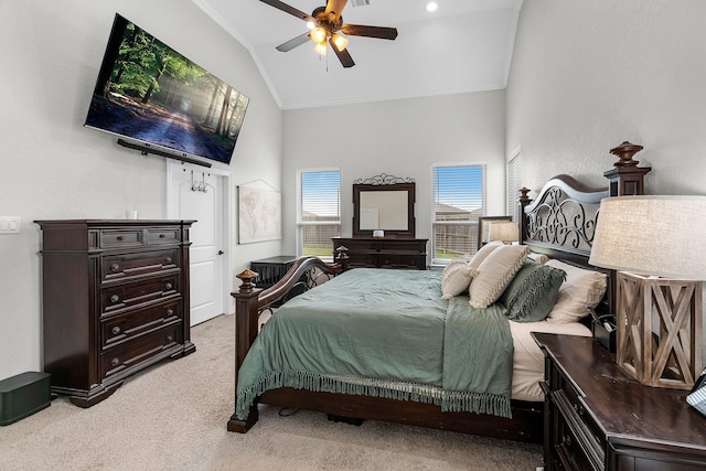 bedroom with ornamental molding, high vaulted ceiling, ceiling fan, and light colored carpet