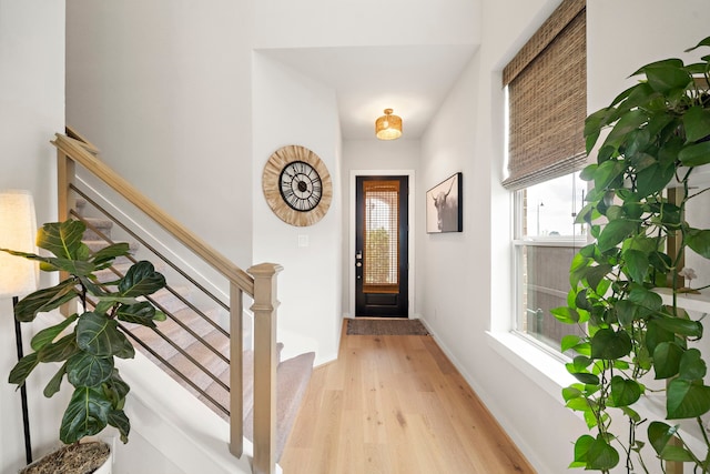 6578 Scarlet Pond Ln, Fulshear, TX 77441 - entrance foyer featuring stairway, baseboards, and light wood-type flooring