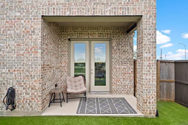 property entrance with brick siding