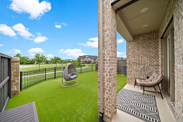 view of yard with fence and cooling unit