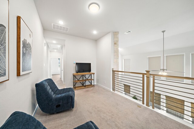 sitting room featuring visible vents, attic access, carpet floors, and recessed lighting