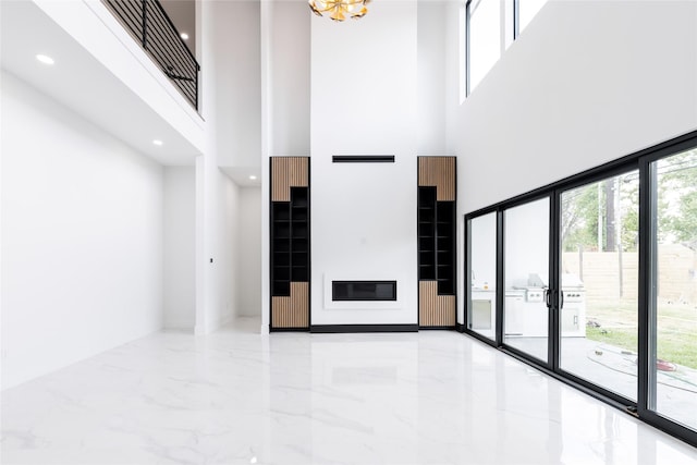 5008 Holt St, Bellaire, TX 77401 - foyer featuring recessed lighting, marble finish floor, and a high ceiling