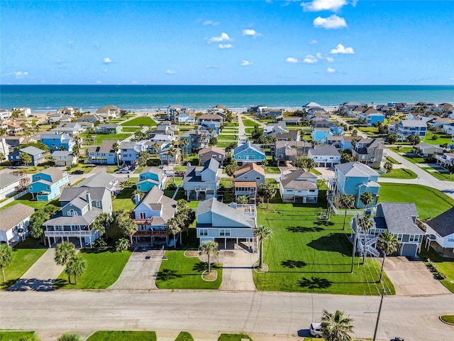 drone / aerial view with a residential view and a water view
