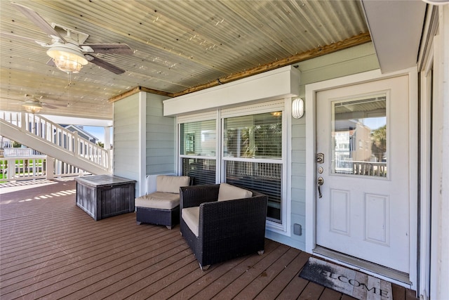 wooden terrace with stairs and ceiling fan