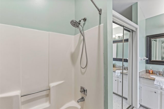 bathroom with shower / bathing tub combination and vanity