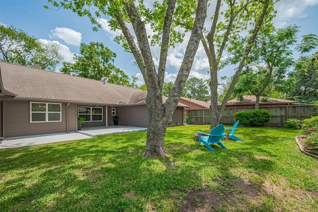 view of yard featuring a patio and fence