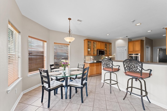 3514 Battle Creek Dr, Missouri City, TX 77459 - dining space with light tile patterned floors, baseboards, and recessed lighting