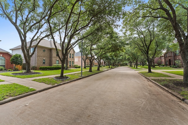 3514 Battle Creek Dr, Missouri City, TX 77459 - view of concrete road with sidewalks, curbs, and a residential view