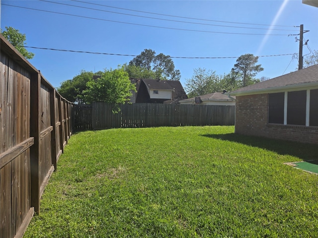 view of yard featuring a fenced backyard