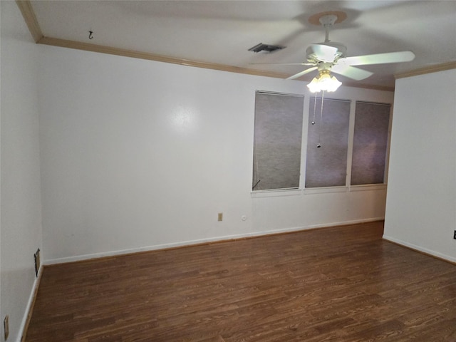 empty room with visible vents, baseboards, ornamental molding, dark wood finished floors, and a ceiling fan