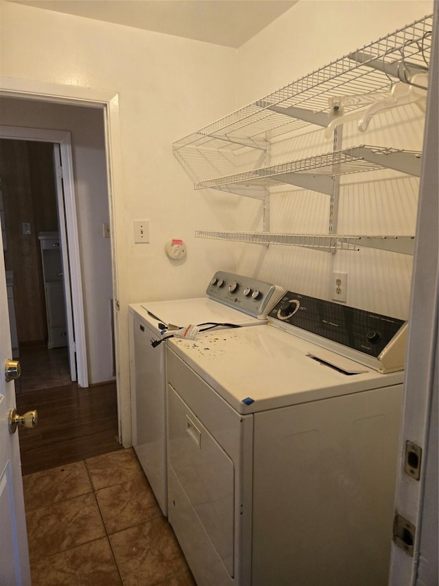 clothes washing area with washer and dryer and laundry area