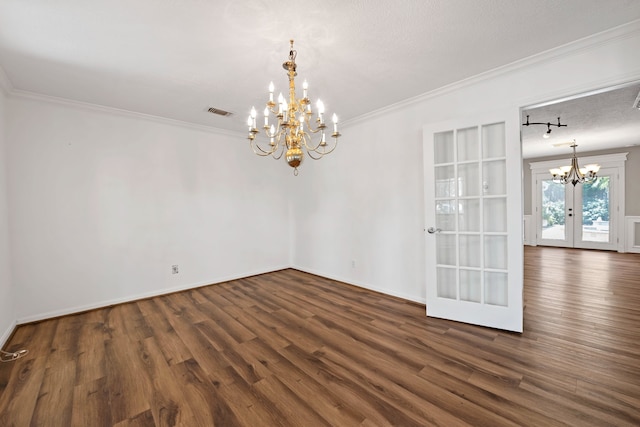 8310 Mentmore Dr, Spring, TX 77379 - unfurnished dining area featuring a chandelier, dark wood-type flooring, french doors, crown molding, and baseboards