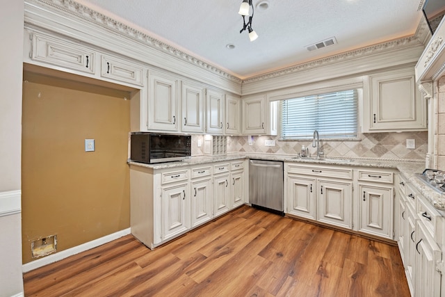 8310 Mentmore Dr, Spring, TX 77379 - kitchen featuring dishwasher, a sink, light wood-style floors, tasteful backsplash, and light stone counters