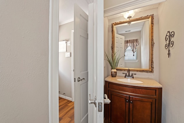 8310 Mentmore Dr, Spring, TX 77379 - bathroom with vanity and wood finished floors