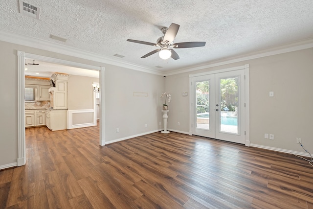 8310 Mentmore Dr, Spring, TX 77379 - empty room featuring dark wood finished floors, a ceiling fan, french doors, ornamental molding, and a textured ceiling