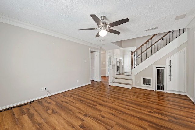 8310 Mentmore Dr, Spring, TX 77379 - unfurnished living room featuring wood finished floors, ceiling fan, stairway, a textured ceiling, and baseboards